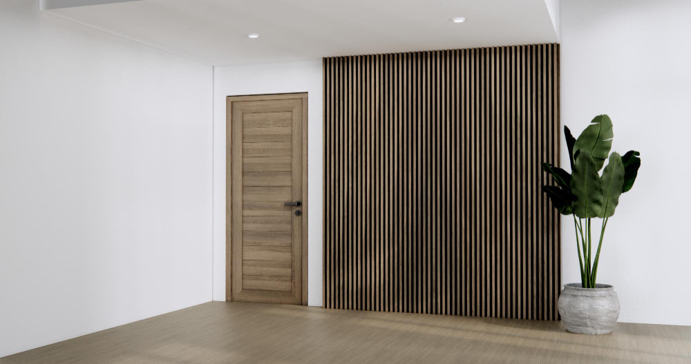 Entryway design with dark wood slat feature wall beside a wooden door and indoor plant.