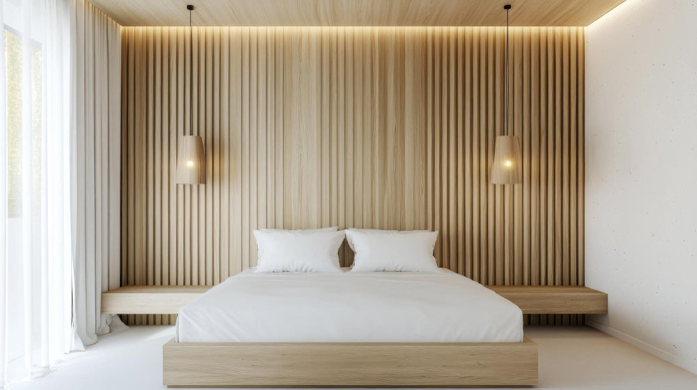Scandinavian-style bedroom with light wood feature wall and ceiling panels with soft lighting.