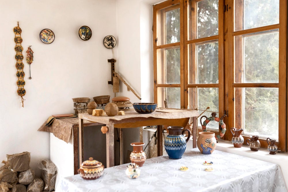 Modern Americana design blending rustic wood, clean white walls, and brass fixtures for timeless, balanced interiors.