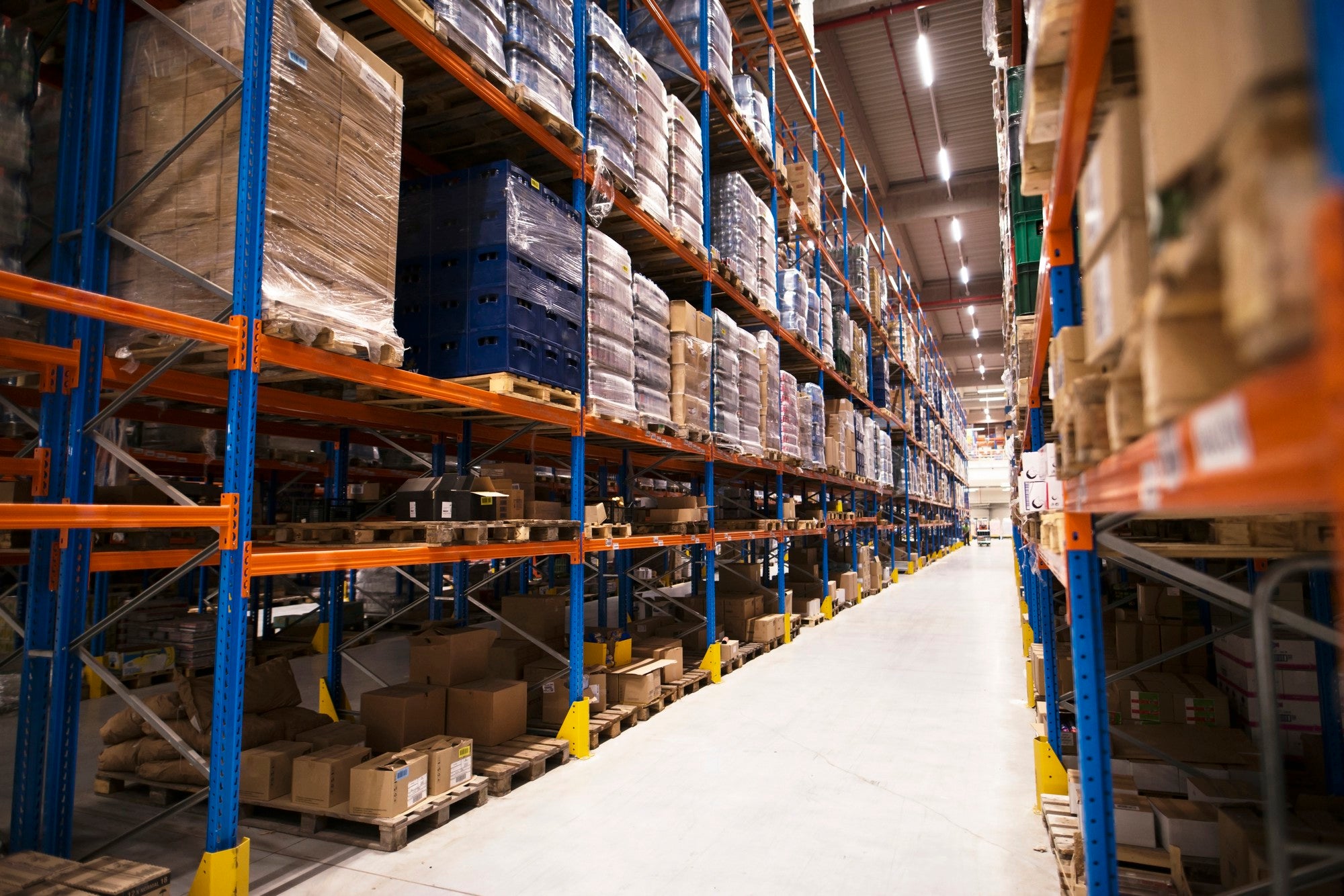 Large home improvement store with neatly stacked shelves and products ready to buy.